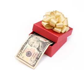 Red gift box with dollar bills on white background